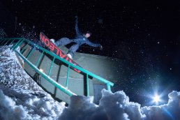snowboarder sending rails uai